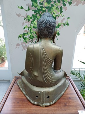 Lot 82 - A Malaysian Bronze Figure of a Seated Buddha,...