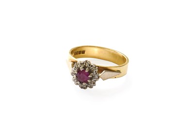 Lot 235 - An 18 Carat Gold Ruby and Diamond Cluster Ring,...