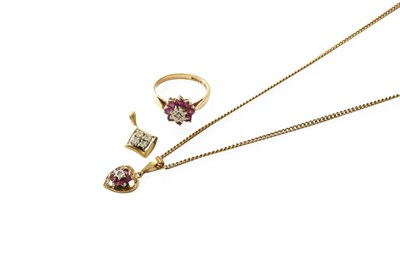 Lot 253 - A 9 Carat Gold Ruby and Diamond Cluster Ring,...