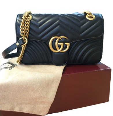 Lot 1025 - A Gucci GG Black Marmont Flap Leather Bag,...