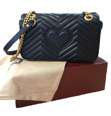Lot 1025 - A Gucci GG Black Marmont Flap Leather Bag,...