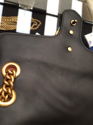 Lot 1025 - A Gucci GG Black Marmont Flap Leather Bag,...
