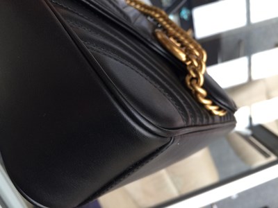 Lot 1025 - A Gucci GG Black Marmont Flap Leather Bag,...