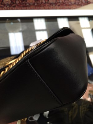 Lot 1025 - A Gucci GG Black Marmont Flap Leather Bag,...