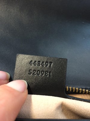 Lot 1025 - A Gucci GG Black Marmont Flap Leather Bag,...