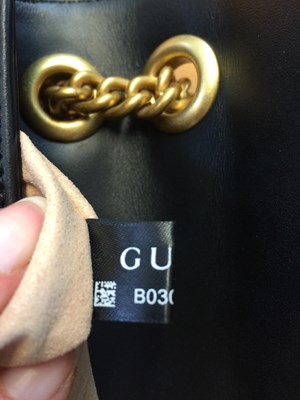 Lot 1025 - A Gucci GG Black Marmont Flap Leather Bag,...
