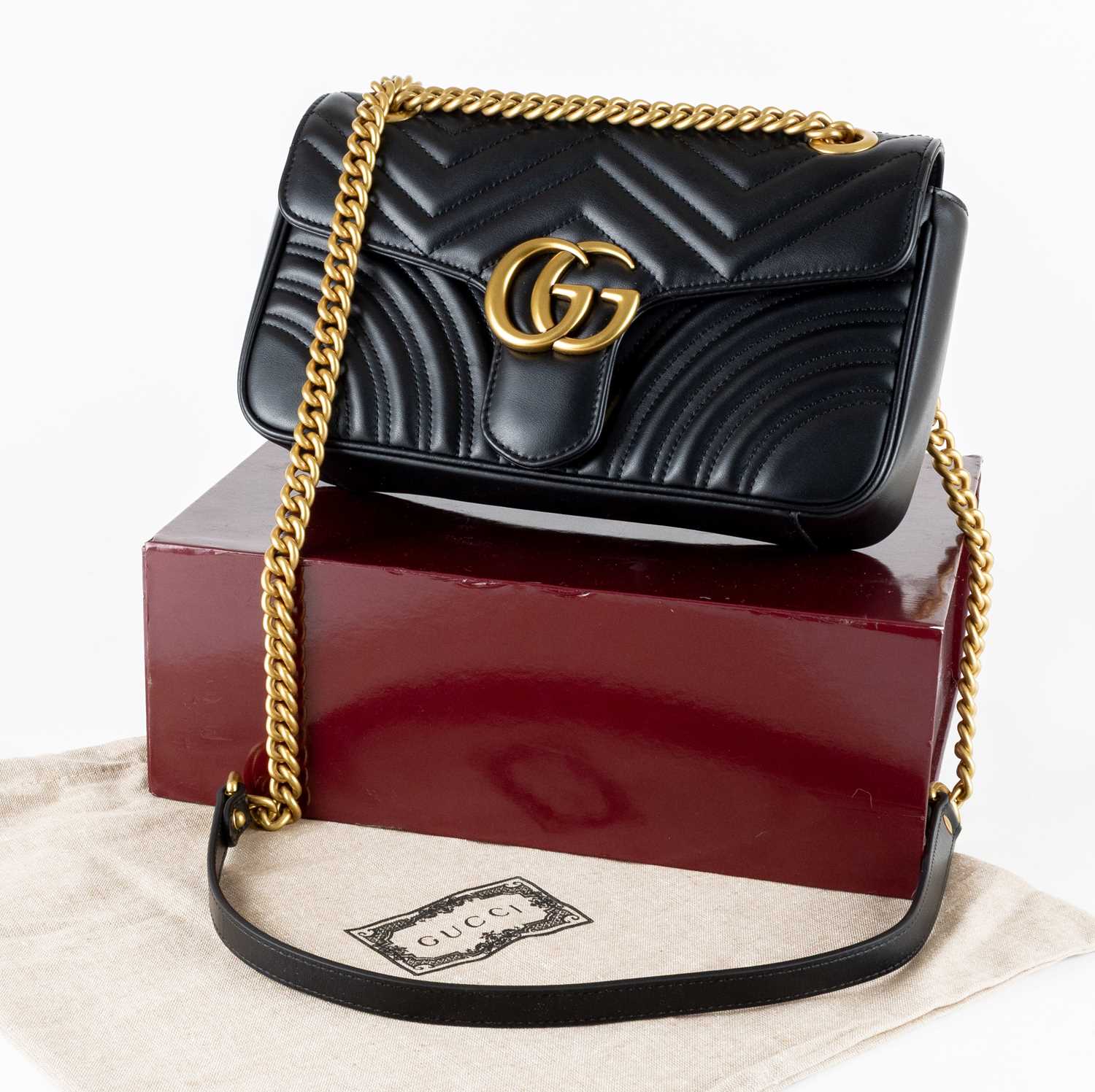 Lot 1025 - A Gucci GG Black Marmont Flap Leather Bag,...
