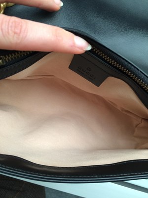 Lot 1025 - A Gucci GG Black Marmont Flap Leather Bag,...