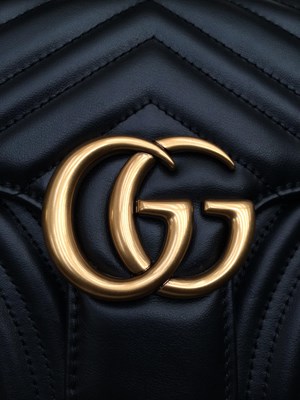 Lot 1025 - A Gucci GG Black Marmont Flap Leather Bag,...