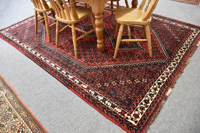 Lot 1094 - Kashgai Carpet, the raspberry field centred by...