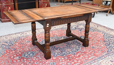 Lot 1342 - An Oak Titchmarsh & Godwin Draw Leaf Dining...