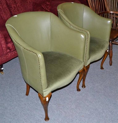 Lot 312 - Pair of green vinyl upholstered tub chairs