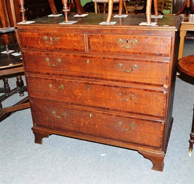 Lot 317 - A 19th century crossbanded oak four height chest of drawers