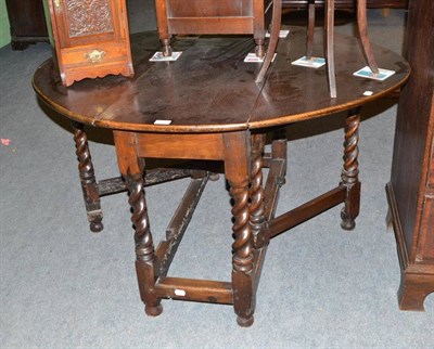 Lot 319 - An 18th/19th century oak barley twist gateleg table