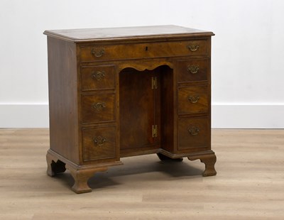 Lot 588 - A George III-Style Kneehole Desk, the moulded...