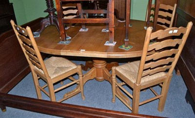 Lot 324 - Solid pine table and four rush seated chairs