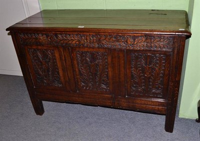 Lot 336 - An 18th century and later carved oak coffer