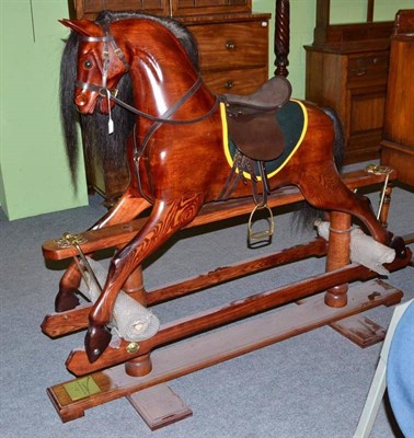 Lot 340 - A modern Camtex hand carved traditional rocking horse *subject to VAT on the hammer price