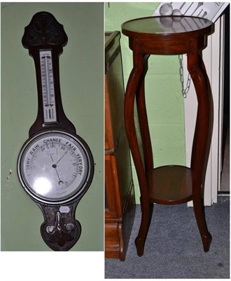 Lot 342 - An aneroid barometer and a jardiniere stand