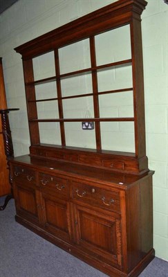 Lot 345 - A reproduction oak dresser and plate rack