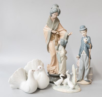Lot 135 - A collection of Lladro and Nao figures and...