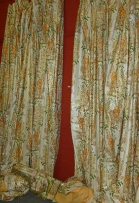 Lot 384 - A pair of floral curtains, interlined, and with pelmet and swag, 117"; high, 142"; wide each