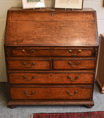 Lot 1412 - A George III Oak Bureau, crossbanded in...
