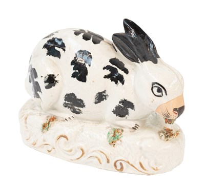 Lot 69 - A Staffordshire Pottery Model of a Rabbit,...