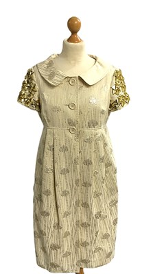 Lot 1012 - A Moschino Cheap and Chic Cream and Gilt...