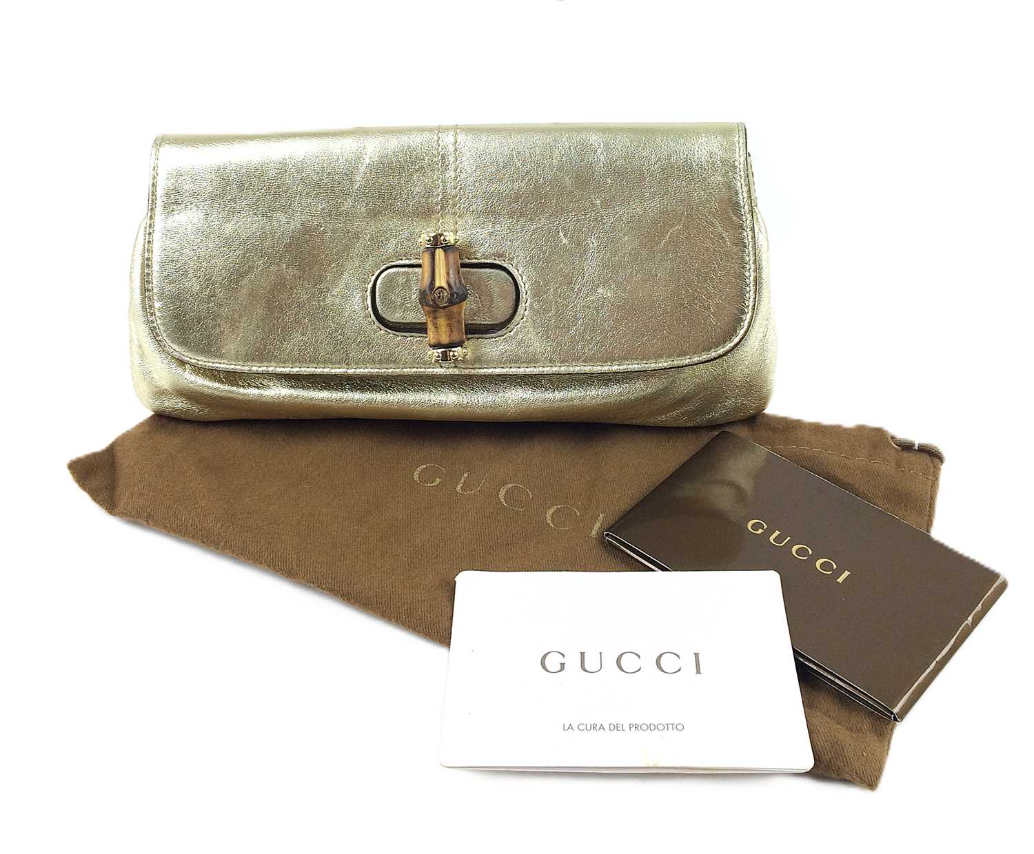 Lot 1014 - A Gold Leather Gucci Bamboo Turn Lock Clutch...