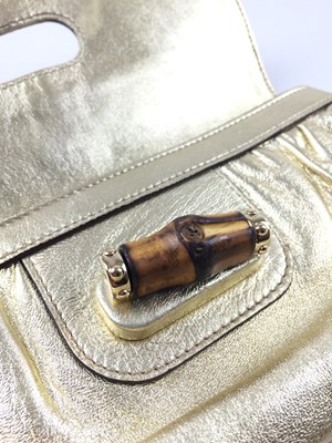 Lot 1014 - A Gold Leather Gucci Bamboo Turn Lock Clutch...