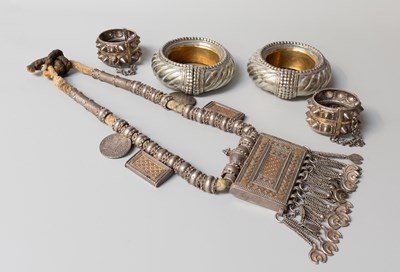 Lot 147 - An Omani Silver Amulet, Two Bangles and Two...