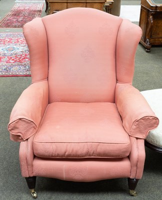 Lot 1349 - A Reproduction Wingchair with Salmon Pink...