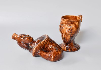 Lot 33 - A Victorian Treacle Glazed Flask, in the form...