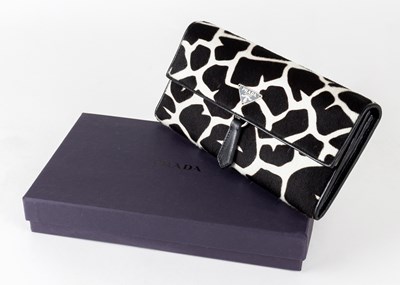 Lot 1060 - A Prada Black and White Hide Wallet, with...