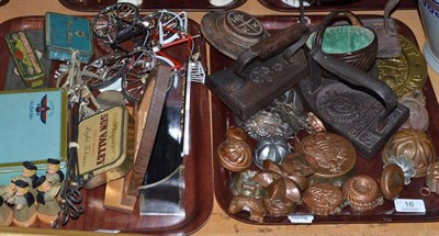 Lot 16 - Two trays of collector's items including a carved wooden choir group, two military flat irons...