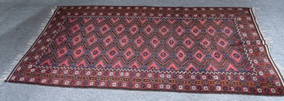 Lot 1266 - Baluch Rug, the indigo field of hooked güls...