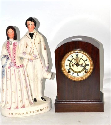 Lot 40 - A Staffordshire ceramic group and a striking mantel clock