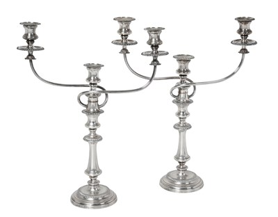 Lot A Pair of George III or George IV Old Sheffield Plate Three-Light Candleabra