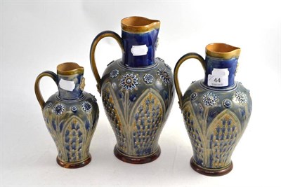 Lot 44 - Graduated set of three Doulton stoneware jugs