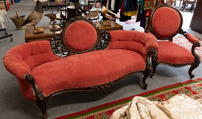 Lot 1097 - A Victorian Chaise Longue, with floral carved...