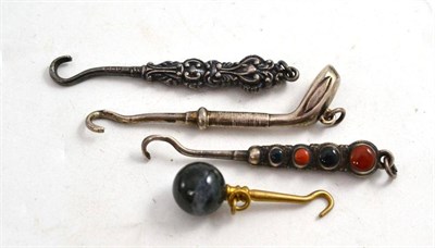 Lot 73 - A golf stick button hook and three others