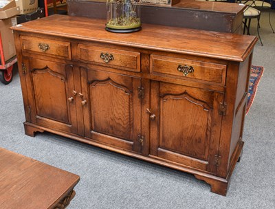 Lot 1131 - A 20th Century Tudor Rose Oak Dresser Base, of...