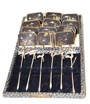 Lot 83 - Set of twelve Japanese menu holders and a set of silver cocktail sticks