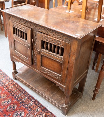 Lot 1259 - An 18th Century Carved Oak Food Cupboard, with...
