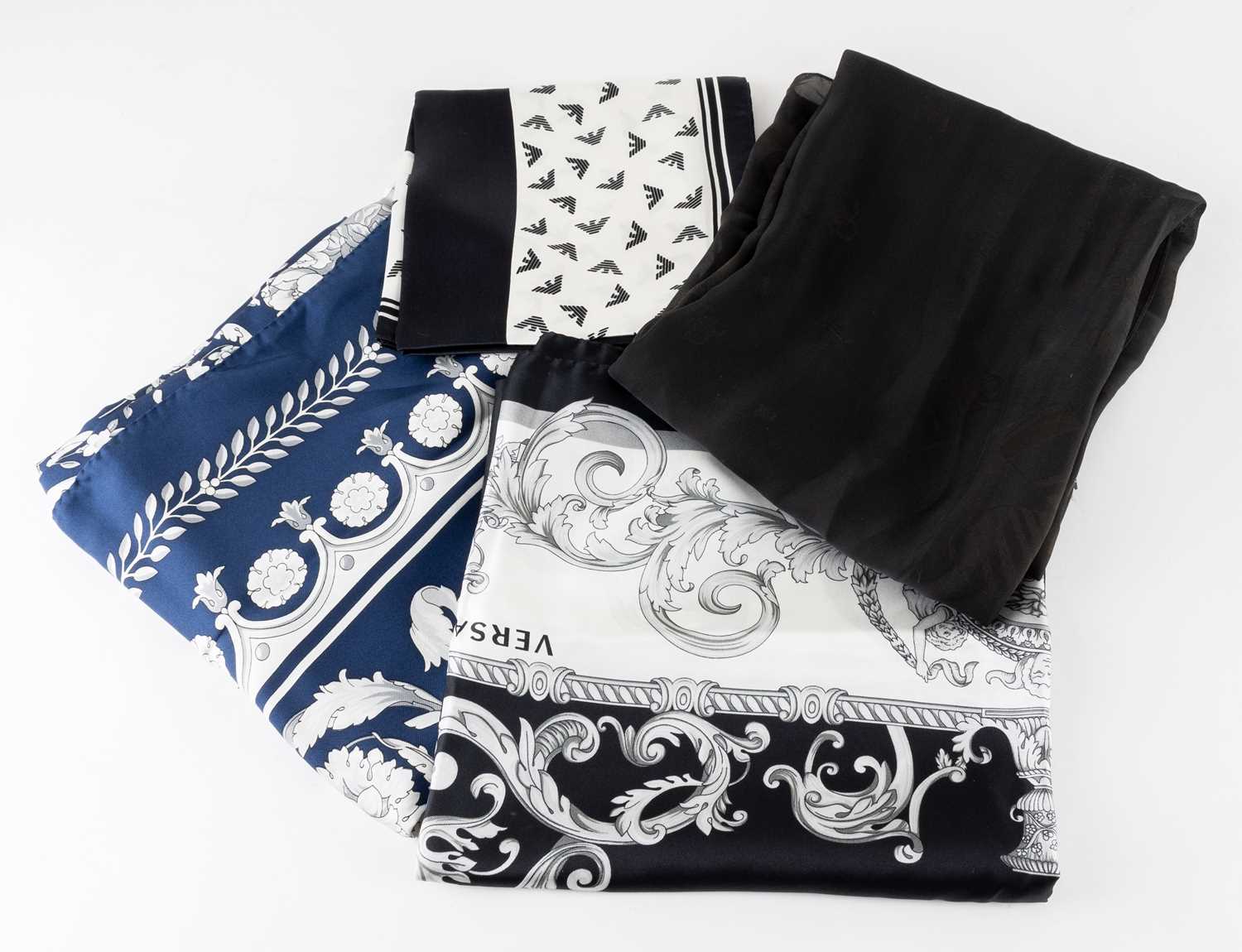 Lot 1005 - Emporio Armani Navy Silk Scarf, featuring the...