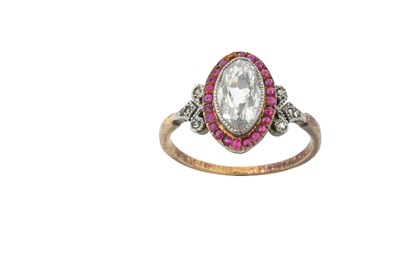 Lot 2269 - A Diamond and Ruby Cluster Ring the marquise...