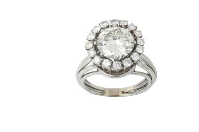 Lot 2326 - A Diamond Cluster Ring the central round...
