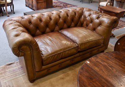 Lot 1128 - A Modern HALO Brown Leather Two Seater Sofa,...