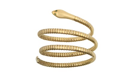 Lot 2435 - A Snake Bangle the plain polished head with...